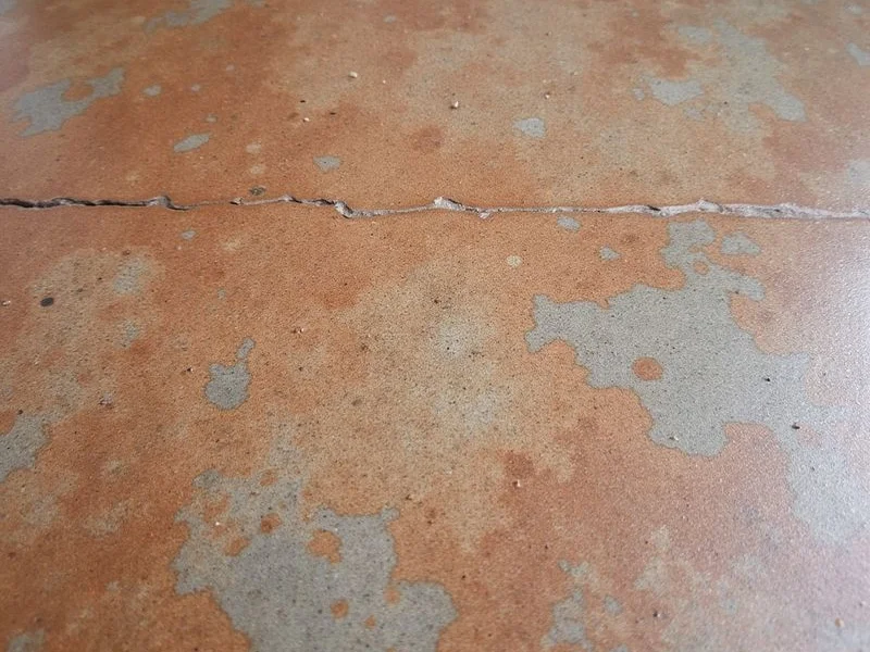 Close-up of mottled acid-stained concrete showing natural variation