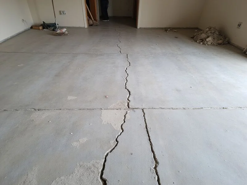 Old patched and cracked slab before resurfacing