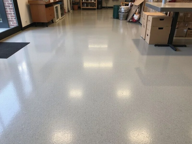 Salt-and-pepper polished concrete floor in a small retail space